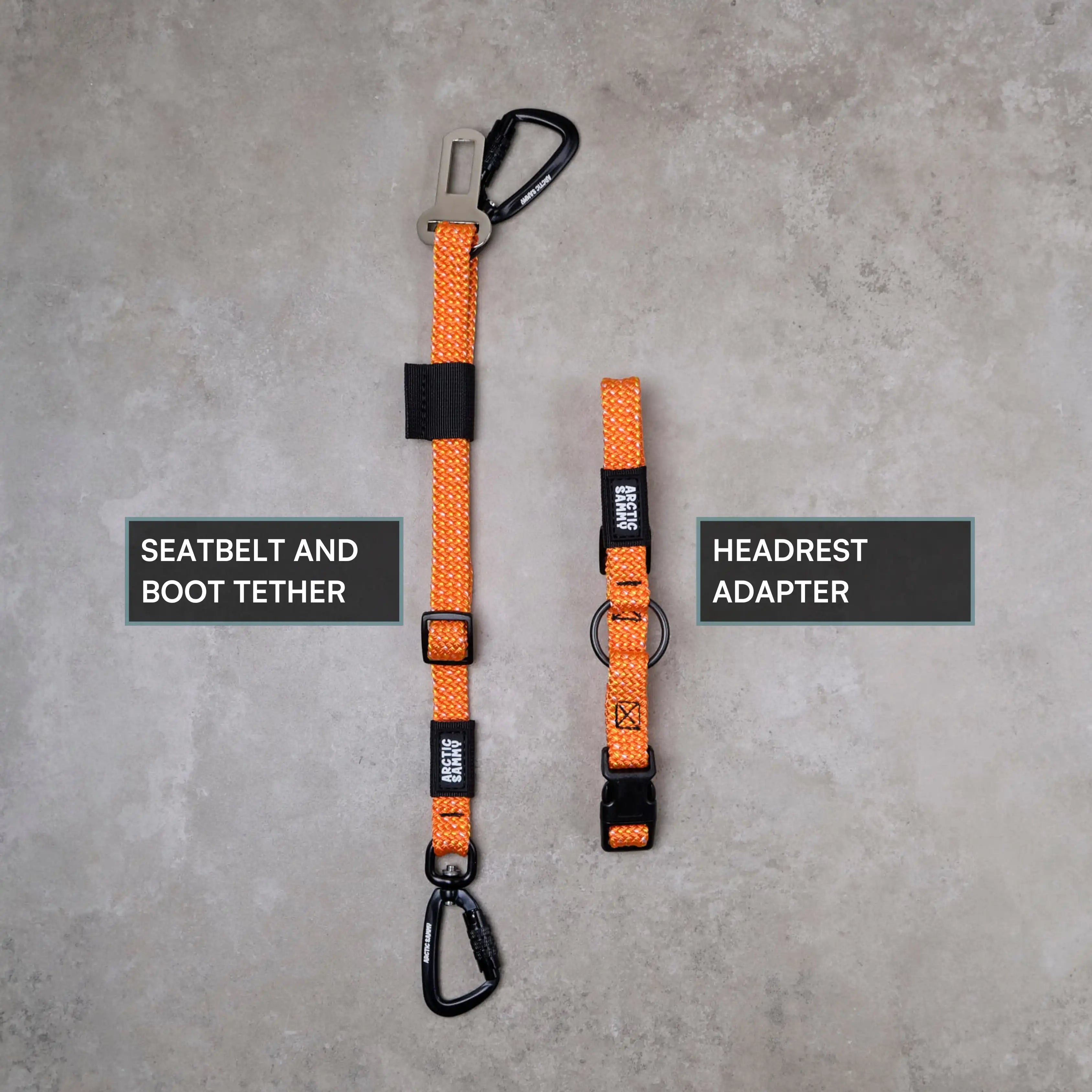 Orange seatbelt and boot tether with headrest adapter on a gray background